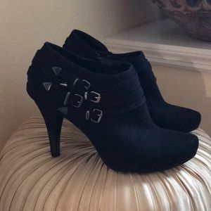 black bootie heels with buckles on sides